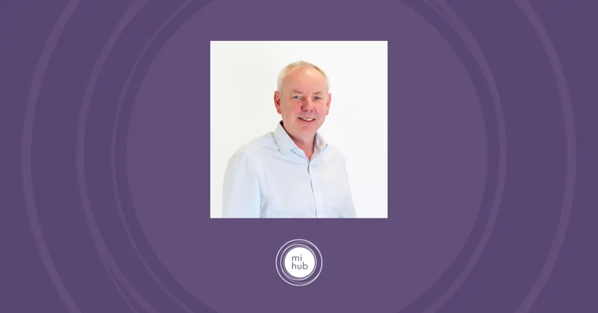 Headshot of Philip Ellis on background with the Mi Hub logo